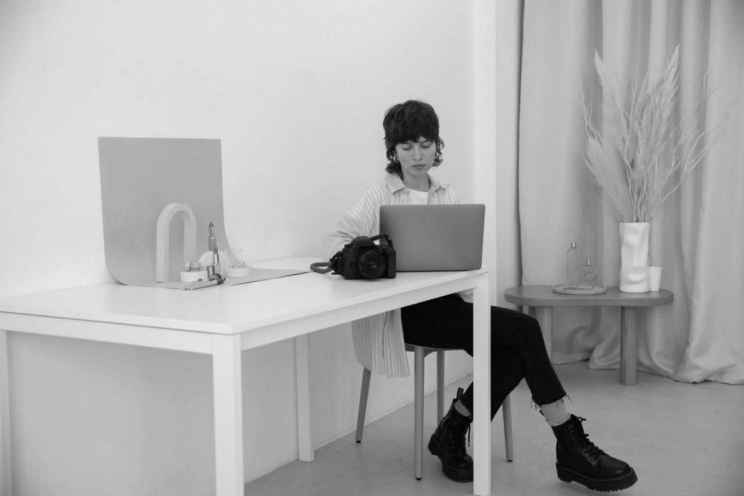 Person reviewing financial documents in organized manner